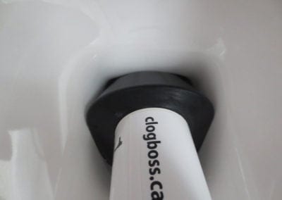 CLOG BOSS® Bathroom Plunger Inserted Into a Clogged Toilet